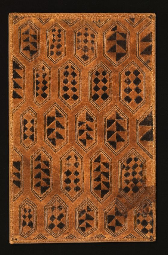 an intricately designed wooden panel with black and brown designs