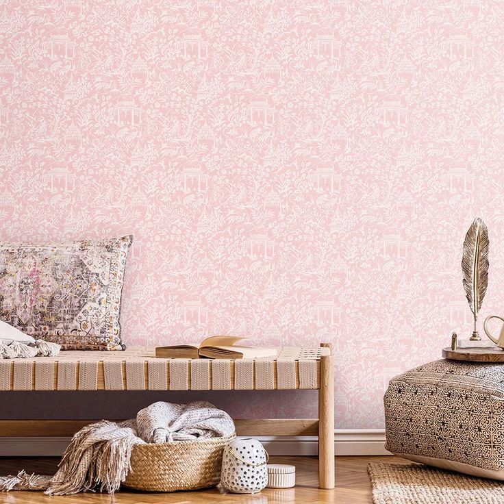 a living room with pink wallpaper and wooden flooring, including a bench in the middle