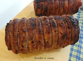 two pieces of meat sitting on top of a cutting board