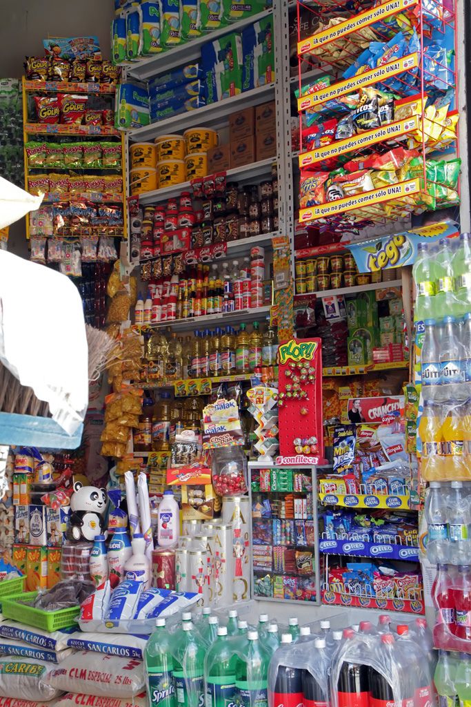 a store filled with lots of different types of drinks and condiments for sale