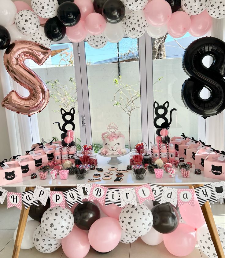 a birthday party with balloons and decorations