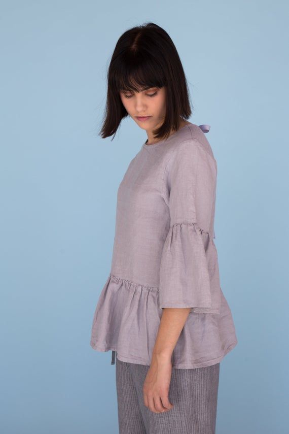 MsWrinkle’s clothing – from human to human.  100% handmade.*Description*- Linen blouse with ruffles and cute bow on the back;- High quality European linen;- Washed and softened (doesn't shrink anymore);- Medium weight linen (150 g/m2);- Our linen is OEKO-TEX certified that meets human ecological safety requirements;- Model is wearing size S in elephant grey (other sizes and colors please choose on the right);- Not transparent;- Not ironed and we suggest to use tumble dryer to keep soft and natur Summer Tops With Gathered Flutter Sleeves, Summer Flutter Sleeve Top With Gathered Sleeves, Casual Linen Blouse For Brunch, Spring Linen Blouse For Casual Gatherings, Spring Linen Top For Brunch, Linen Blouse For Casual Gatherings In Spring, Linen Tops For Fall Brunch, Fall Linen Blouse For Brunch, Fall Linen Tops For Brunch