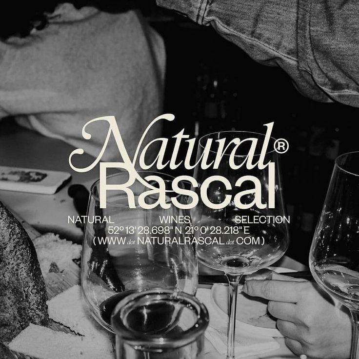 two wine glasses sitting on top of a table next to each other with the words natural rascal