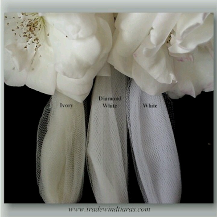 two white flowers with the words diamond white on them