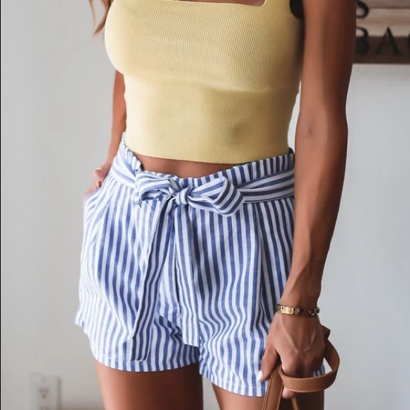 Sweet Linen Stripe Shorts For Your Spring Outfits! Tie Is Connected From The Back And You Tie Along The Front. These Casual Yet Chic Shorts Would Be Perfect For Warmer, Summer Days. Complete The Look With A White Bodysuit, Flat Mules, And A Light Cardigan. Model Is Wearing A Size Small A 2/4 M 6 L 8/10 Xl 12 Blue Tie Waist Shorts For Spring, Blue Shorts With Tie Waist For Spring, Casual Blue Bottoms With Tie Waist, Striped Tie Waist Bottoms For Summer, Blue Bottoms With Tie Waist For Day Out, Blue Tie-waist Bottoms For Day Out, Blue Tie Waist Bottoms For Spring, Blue Bottoms With Tie Waist For Spring, Striped Shorts Outfit