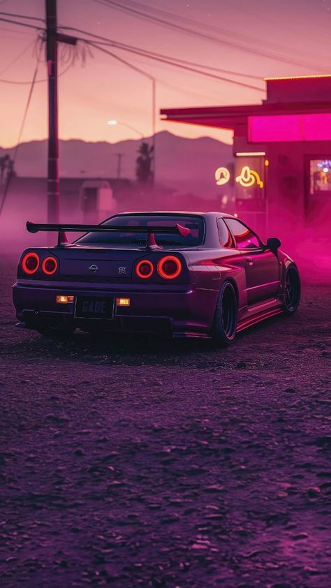 a purple car parked in front of a gas station at night with the lights on