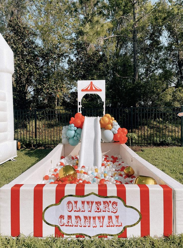 an inflatable carnival float with balloons and streamers