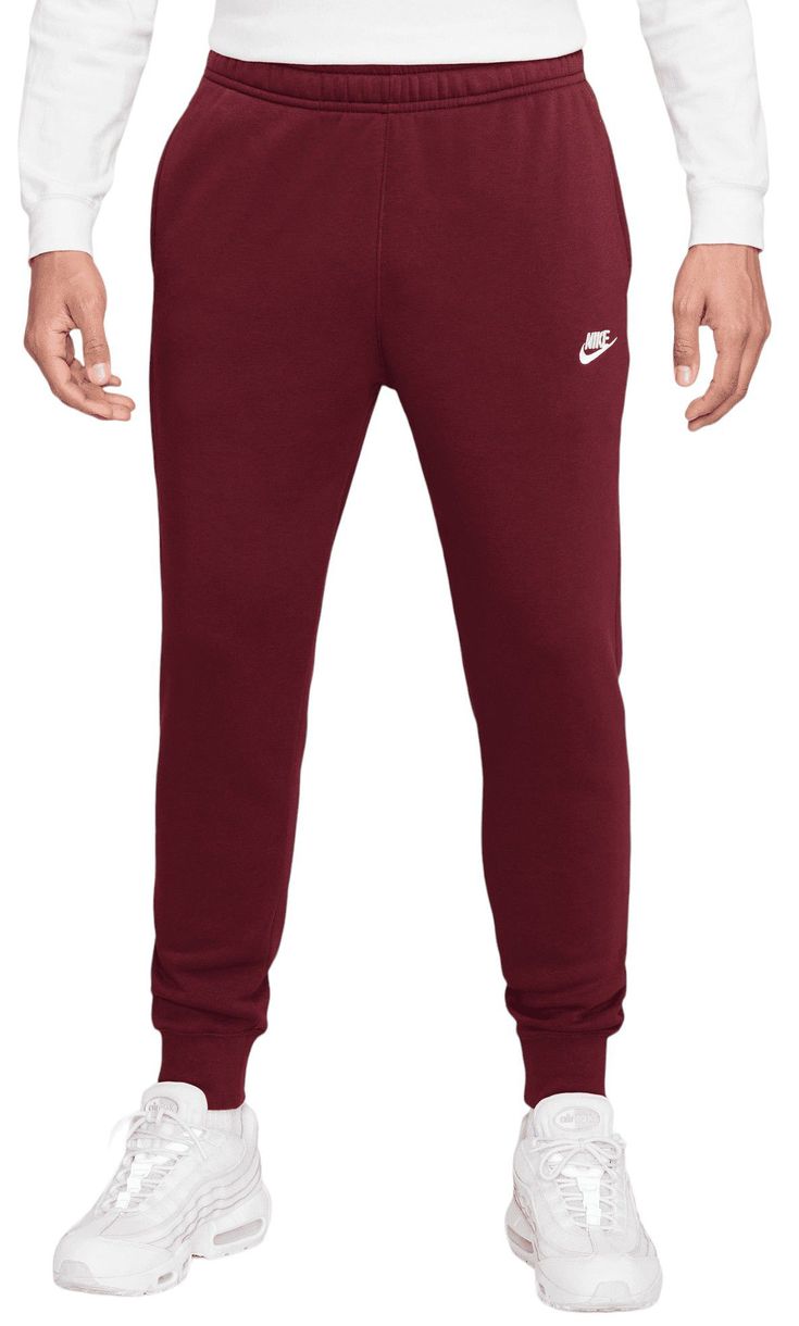 For an athletic look and superior comfort, choose the Nike® Men’s Sportswear Club Fleece Jogger Pants. Incredibly soft, brushed fleece material delivers a soft, warm feel, while the modern jogger silhouette offers the sleek style you crave. Fit & Design Loose fit jogger pants Super soft, brushed fleece keeps you warm and comfortable Tapered leg construction with cuffed ankles achieves a modern silhouette Elastic waistband with built-in drawcord lets you adjust your fit Built-in hand pockets let you easily stash your essentials Nike® graphic and Swoosh logo add subtle style to your outfit Casual Red Nike Sweatpants, Nike Red Casual Sweatpants, Cheap Fleece Sports Joggers, Nike Red Joggers For Streetwear, Red Fleece Athleisure Sweatpants, Men's Sportswear, Team Red, Athletic Looks, Fitted Joggers