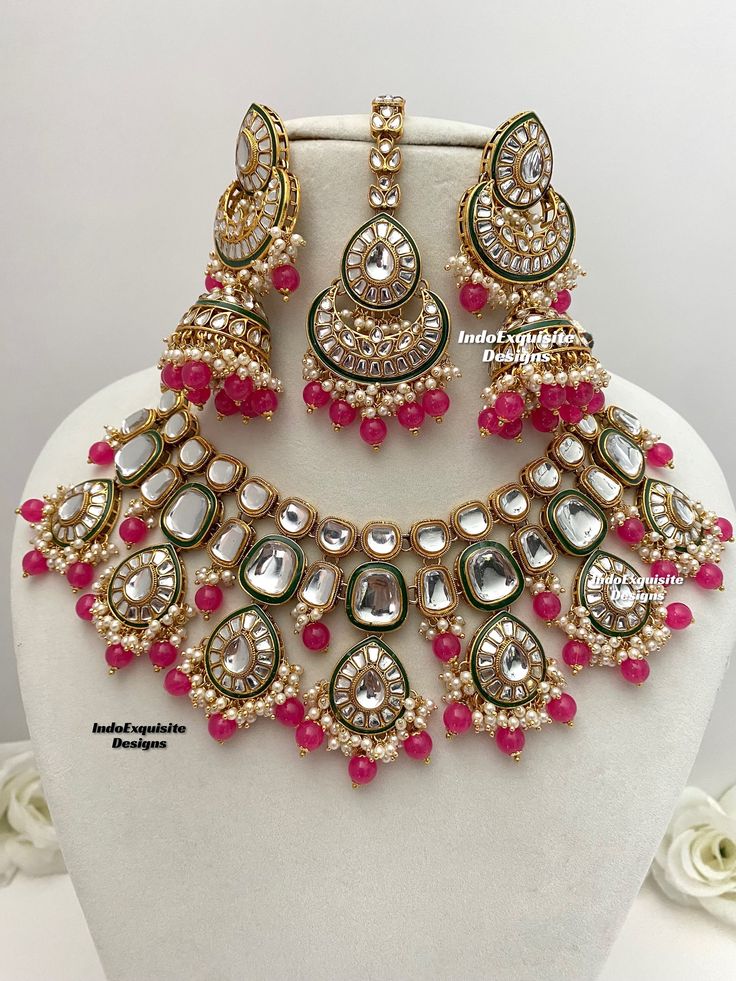 Premium quality Kundan Necklace comes with elegant Jhumki Earrings and Tikka/ trendy Indian bridal set/Premium Quality Polki and Kundan Jewelry/fuschia/Fucsia/hot pink/Rani/Magenta     All items are shipped from Brampton, Ontario, Canada. If you need your item by a certain day, please reach out to us for express delivery option before placing the order so that we can update the shipping for you. Standard shipping/delivery timeline Below are the delivery timeline estimates. We dispatch all orders Pink Kundan Necklace For Festivals, Bollywood Style Pink Bridal Sets For Wedding, Heavy Pink Bridal Necklace For Wedding, Pink Kundan Jewelry Sets, Pink Round Kundan Necklace For Diwali, Pink Chandbali Kundan Necklace For Wedding, Heavy Pink Kundan Necklace For Wedding, Festive Pink Chandbali Bridal Necklace, Pink Meenakari Bridal Necklace For Festive Occasions