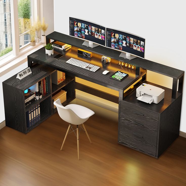 a computer desk with two monitors and a printer