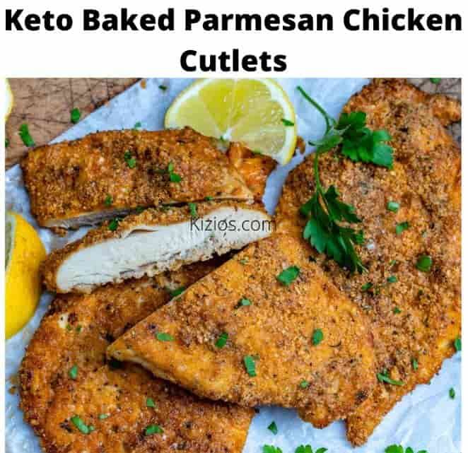 keto baked parmesan chicken cutlets with lemon wedges