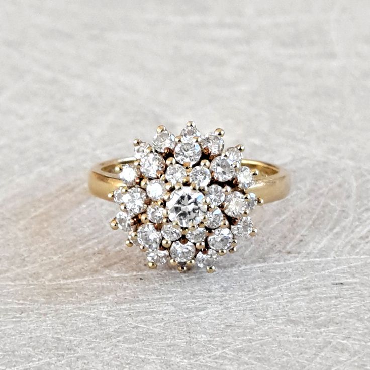 Vintage 1.03 Ctw Diamond Cluster Ring, Floral Design Ring 18K Yellow Gold, Sparkly and Gorgeous! GIA G.G. Appraisal Included 2,490 Usd! A stunning cluster of bright white diamonds, all full round brilliant cut, decorate this crown that measures approximately 13.48mm in diameter and rises 10mm from the finger. The shank is smooth and polished and measures 2mm at the back. Inside the shank is stamped with what is presumed a makers mark of "JF" as well as "18K". This is a wonderful piece for an eng Luxury Gold Cluster Ring With Pave Setting, Vintage Diamond Cluster Rings, Lovely Ring, Diamond Cluster Ring, Fine Jewelry Collection, Diamond Cluster, Vintage Diamond, White Diamonds, Round Brilliant Cut Diamond