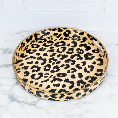 a leopard print tray sitting on top of a marble counter