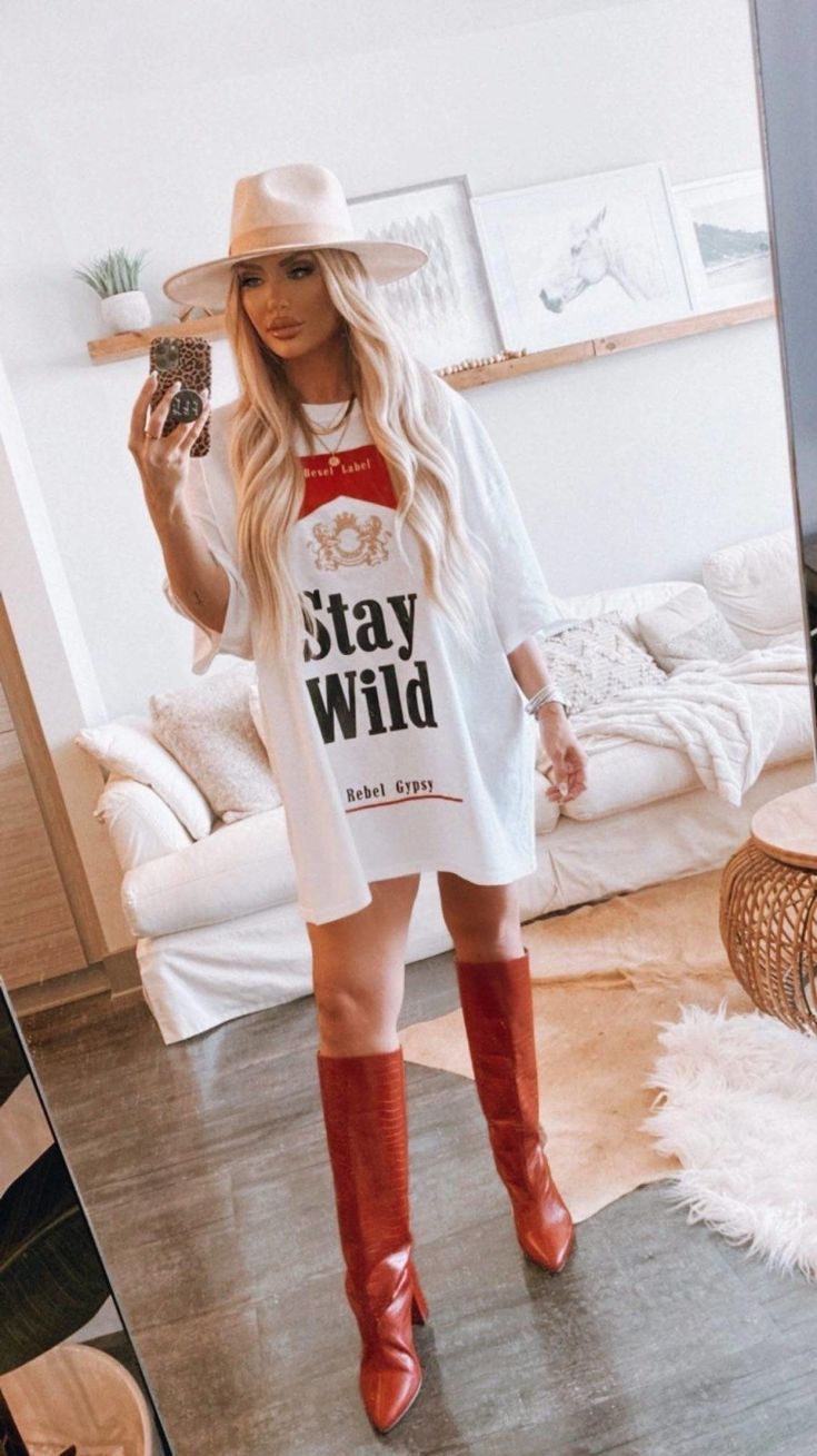 Stay Wild T-Shirt Dress is concert, rodeo, and nash bash approved! Our Stay Wild T-Shirt Dress is comfortable and fitted, so you can rock out at Stagecoach Festival, Coachella, Bonnaroo, Lollapalooza or anywhere else. Plus, everyone deserves a festival T-Shirt Dress fit. You'll get compliments everywhere you go with this Rebel Gypsy vibe! To make sure you have the right fit – we want everyone feeling good when they wear this outfit - check our size chart. Hoedown Outfit Parties, Oversized Country Tshirt Outfit, Country Music Festival Outfits Casual, Bohemian Rock Style Outfit, Country Tshirt Dress Outfit, All American Rejects Concert Outfit, Post Malone Concert Outfit Women, Jellyroll Concert Outfit Ideas, Fun Going Out Outfits