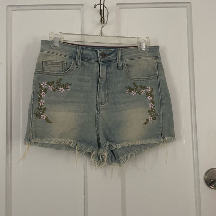 Embroidered Shorts With A Raw Hem. Never Worn. Embroidered High Rise Blue Bottoms, Casual High Rise Embroidered Jeans, High Rise Denim Bottoms With Floral Embroidery, High-rise Denim Bottoms With Floral Embroidery, Embroidered High Rise Cotton Bottoms, High Rise Embroidered Cotton Bottoms, Embroidered High-rise Cotton Bottoms, Embroidered Medium Wash Cotton Jean Shorts, Embroidered Denim Blue Jean Shorts