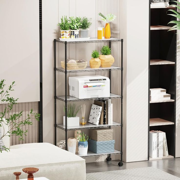 a living room filled with lots of furniture next to a wall mounted planter and bookshelf