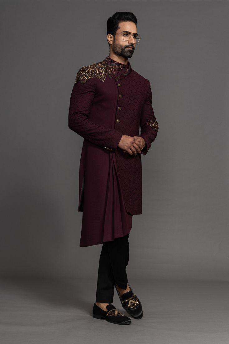 Here's a novel pairing for people who love to try out and experiment with new attires. The crimson Indowestern suit of Purusham perfectly blends elegance with modernity. Make your wedding a royal affair with Purusham's Regal Crest collection. 

All types of customization can be done in any colour that suits you. WhatsApp on +91 98204 74707 for customization inquiries. Stylish Sherwani For Men, Indo Western Men, Indowestern Outfits For Men, Indo Western Outfits For Men, Indo Western Dress For Men, Indian Wedding Suits Men, Indowestern Sherwani, Indian Groom Dress, Indo Western Sherwani