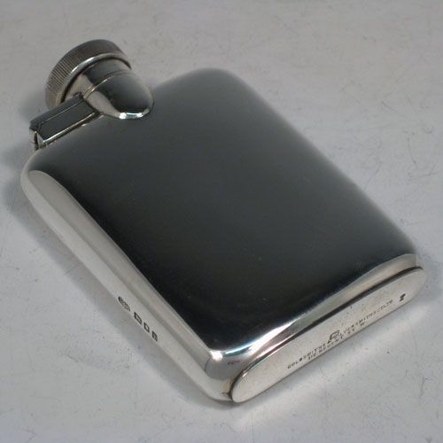 a black and silver flask on a white table