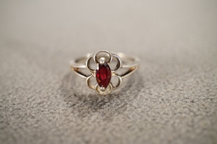 I am offering you this vintage sterling silver wedding band stacker design ring.  This features a raised relief  single stone setting.  This has a prong set marquise shaped genuine Garnet stone set in it.  This ring is currently a size 7 3/4, though I am sure it could be sized up or down. Please review all of my pictures, as they are all a very important part of , my listing/descriptions. Vintage Stackable Jewelry With Round Band, Vintage Stackable Rings For Formal Occasions, Vintage Round Band Stackable Rings, Vintage Sterling Silver Birthstone Ring, Vintage Stamped 925 Toe Ring, Vintage Engraved Stackable Round Ring, Vintage Stackable Jewelry For Promise Ring, Vintage White Gold Stackable Jewelry, Vintage Birthstone Rings With Round Band