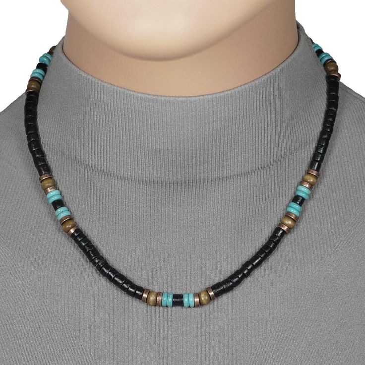 This fashionable handmade necklace is made with black coco shell heishi beads along with turquoise, copper and wood accent beads.  It is available in your choice of 16, 18, 20 or 24 inches long.  It is sure to compliment many outfits.  This necklace would be perfect for both men and women.  It is strung on strong and flexible Accuflex wire and is finished with a lobster claw clasp. The finished length may vary +/- 1/4 inch. Please view the 18 inch model shot for size reference on an adult female Black Beaded Necklaces With Spacer Beads For Beach, Black Beaded Necklaces For Beach, Black Heishi Beads For Beach, Black Heishi Beads Jewelry, Handmade Black Heishi Beads, Artisan Black Jewelry For The Beach, Handmade Adjustable Black Turquoise Necklace, Black Heishi Beaded Necklaces, Handmade Black Turquoise Necklace With Round Beads