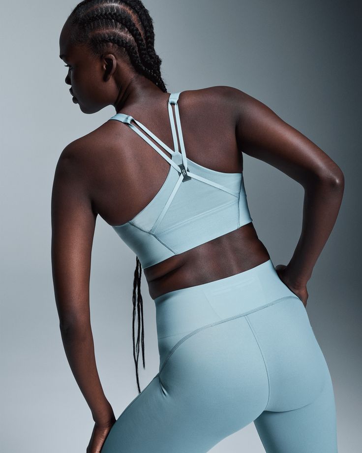 The padded, longline bra with a strappy back design. Made to support your every move during low-mid impact workouts. With its longline silhouette and detailed strap design, this versatile bra begs to be worn all day long. A light layer of fixed padding adds coverage, so you can move in complete comfort. No shirt? No worries. Tough workout? No sweat. Quick-drying, sweat-wicking fabrics keep you feeling fresh and comfortable through every yoga class and spin session. From bicep curls to brunch, yo Running Accessories, Medium Support Sports Bra, Bicep Curls, Longline Bra, Travel Shoes, Active Life, Yoga Bra, Athleisure Wear, Tennis Clothes