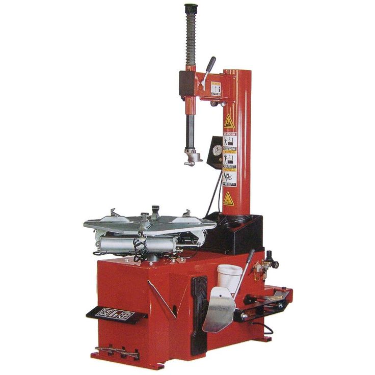 a machine that is sitting on top of a red stand with two machines attached to it