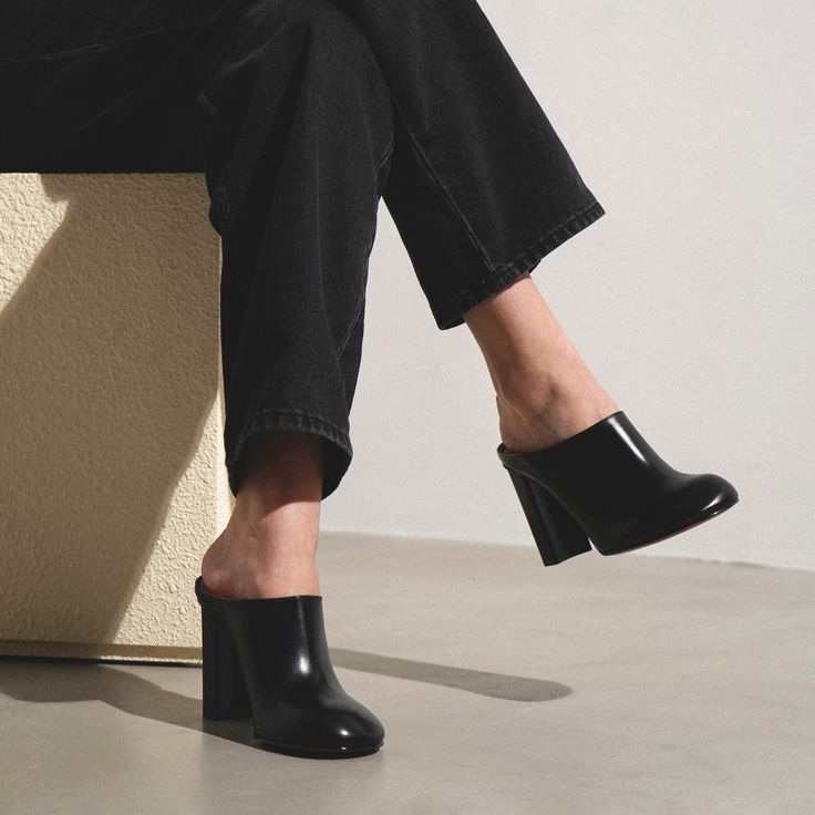 Black leather mules from Alaïa. The Babylone black leather mules are made of smooth calf leather with a rounded toe, set on a block heel measuring 110mm. Leather soleTrue to sizeMade in Italy Black Leather Mules, Leather Mules, Calf Leather, Block Heels, Black Leather, In Italy, Italy, Heels, Leather