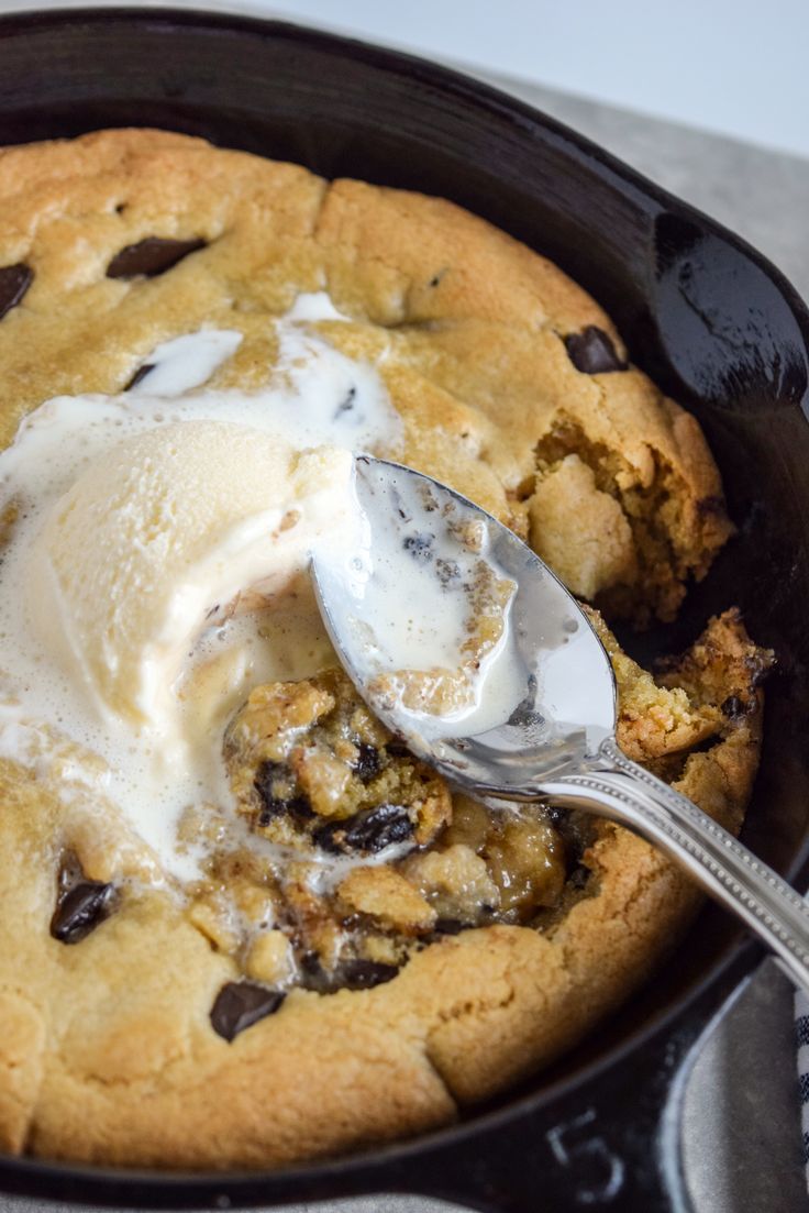 a skillet filled with ice cream and chocolate chip cookies