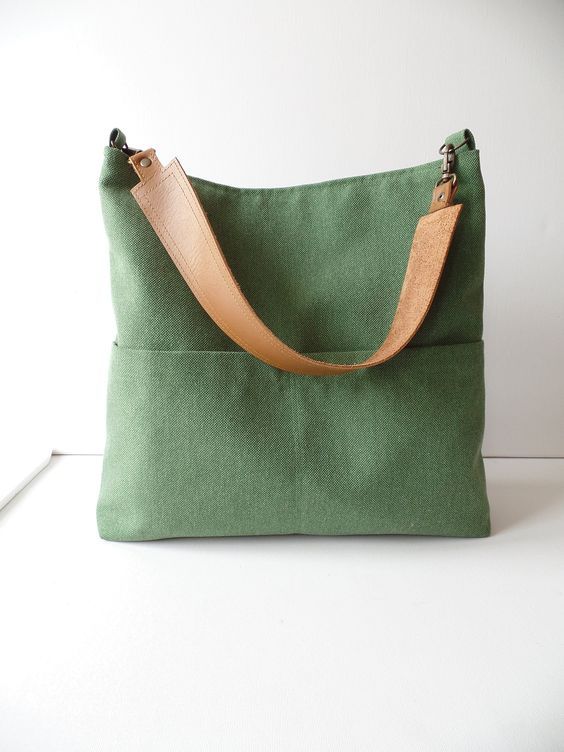 Linen and cotton sturdy canvas everyday casual slouchy hobo purse, medium bucket bag in fresh green. Exterior - High quality natural linen and cotton fabric in fresh green color - Two outside exterior slip pockets *Interior - Natural cotton in grey color. - Two inside interior pockets * Magnetic snap button closure * Real leather strap from high quality italian genuine leather in gorgeous cognac brown color. Reinforced with antique toned brass rivets. Detachable. Available in: - Cognac brown - D Green Canvas Hobo Bag With Large Capacity, Green Large Capacity Canvas Hobo Bag, Large Capacity Green Canvas Hobo Bag, Casual Khaki Hobo Bag For Everyday, Casual Everyday Khaki Hobo Bag, Khaki Canvas Hobo Shoulder Bag, Khaki Canvas Hobo Bag Tote, Everyday Hobo Tote Bag With Pockets, Spring Large Capacity Hobo Bag For Everyday