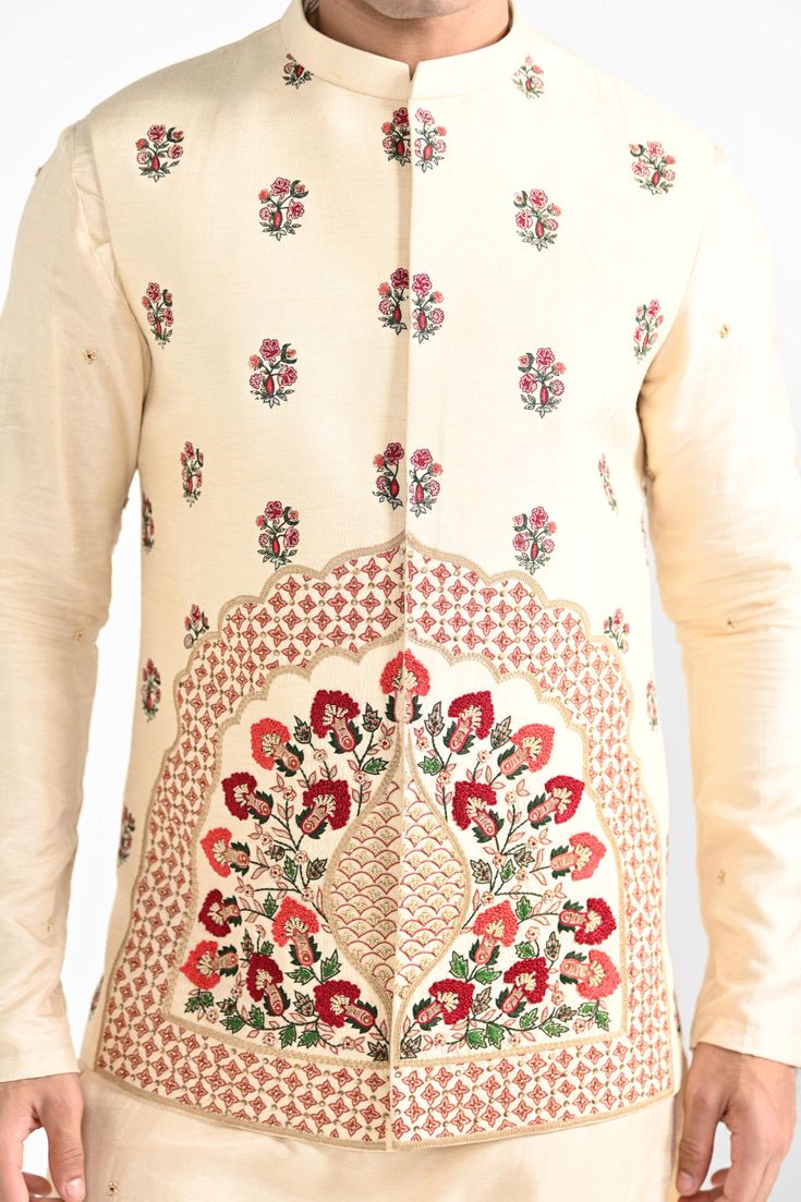 Rajasthani floral Hand embroidered nehru kurta set made in cream bamberg raw silk. Paired with cream slim fit Pant Pajama. Color of the actual garment may vary due to lighting conditions during the shoot.

Size Chart For Men





	
	
					Men's Size Chart
		

		
		
						
				Size Chart For Men
				Custom Size Measurement Guide
			
			
				
				
				Custom Size Measurement Guide
1. Take your measurements at ease…don’t hold your breath!
2. Be a little generous with the measurements. It’s always e Cream Long Sleeve Bandhgala With Resham Embroidery, Cream Bandhgala With Chikankari Embroidery For Eid, Cream Bandhgala With Chikankari Embroidery For Transitional Season, Cream Bandhgala With Long Sleeves For Diwali, Cream Raw Silk Sets For Eid, Cream Long Sleeve Bandhgala For Diwali, Cream Long Sleeve Nehru Jacket For Diwali, Transitional Season Embroidered Raw Silk Sherwani, Festive Cream Silk Sherwani