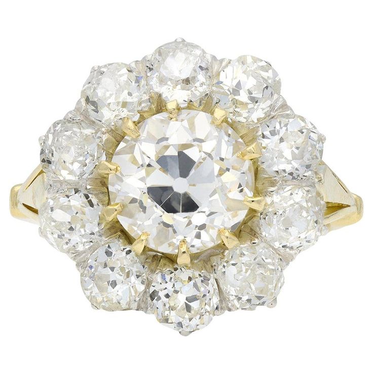 an old cut diamond cluster ring, set in 18ct yellow gold with brilliant diamonds