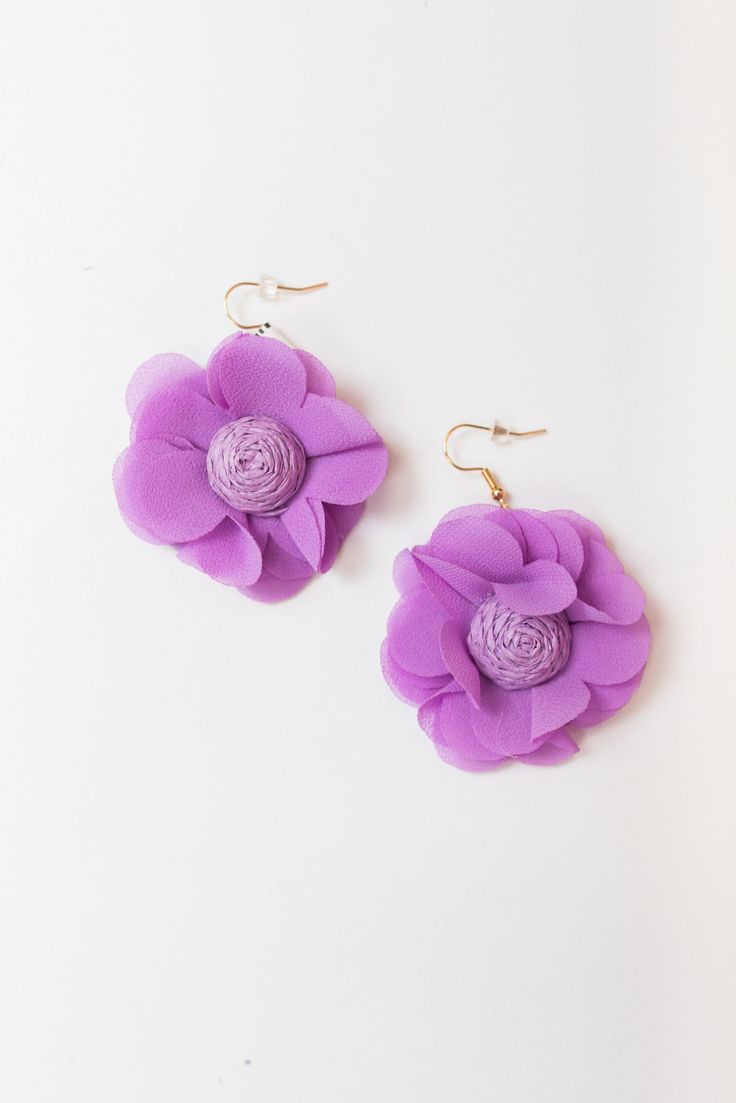 Introducing our Bloom Season Earrings, the epitome of floral elegance and grace. Crafted with meticulous attention to detail, these earrings capture the essence of blooming flowers in full bloom, adding a touch of natural beauty to your ensemble. Each petal is delicately sculpted to resemble the gentle unfurling of petals in spring, creating a sense of movement and vibrancy. The intricate design is complemented by the shimmering brilliance of the central gemstone, which catches the light with every movement, adding a subtle sparkle to your look. Chic Spring Flower Earrings For Pierced Ears, Chic Flower Charm Drop Earrings, Feminine Earrings With Flower Decoration, Spring Flower-shaped Formal Earrings, Chic Drop Earrings With Flower Charm, Feminine Earrings For Spring Formal Occasions, Elegant Purple Flower Earrings, Elegant Purple Flower Shaped Earrings, Spring Flower Earrings For Pierced Ears