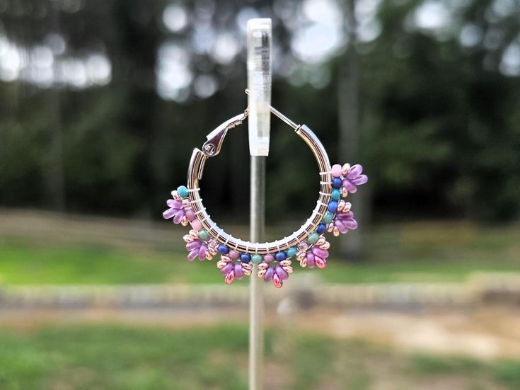 Add a splash of beachy colors to your summer!  Handmade seed bead hoop earrings created with fine glass seed beads in shades of Plum, Blush and Pink Lilac delicately woven onto Stainless Steel hoops.     👉  Arrives in a gift box with bow, ready for giving. 🎁 👉  Measurements:  1 3/8 inches around. 👉  Lightweight and easy to wear 👉  304 Stainless Steel hoops 👉  Miyuki and Toho glass seed beads 👉  Thermally-fused extra strong thread 💜 𝗘𝘃𝗲𝗿𝘆𝘁𝗵𝗶𝗻𝗴 𝗮𝘁 𝗖𝘆𝗻𝘁𝗵𝗲𝗖𝗿𝗲𝗮𝘁𝗶𝗼𝗻𝘀 𝗶𝘀 𝗵𝗮𝗻𝗱𝗺𝗮𝗱𝗲 𝘄𝗶𝘁𝗵 𝗹𝗼𝘃𝗲 - 𝗯𝗲𝗰𝗮𝘂𝘀𝗲 𝘆𝗼𝘂 𝗱𝗲𝘀𝗲𝗿𝘃𝗲 𝘁𝗼 𝗳𝗲𝗲𝗹 𝗲𝘅𝘁𝗿𝗮𝗼𝗿𝗱𝗶𝗻𝗮𝗿𝘆! 💜  💜𝑫𝒆𝒔𝒊𝒈𝒏𝒆𝒅 𝒃𝒚 𝑪𝒚𝒏𝒕𝒉𝒆𝑪𝒓𝒆𝒂𝒕𝒊𝒐𝒏𝒔 Bohemian Dangle Hoop Earrings For Spring, Nickel-free Small Hoop Beaded Earrings For Summer, Bohemian Jewelry With Dangling Beads For Spring, Bohemian Spring Jewelry With Dangling Beads, Summer Multicolor Nickel-free Hoop Earrings, Summer Hypoallergenic Multicolor Jewelry, Summer Hoop Earrings With Tiny Beads For Gift, Multicolor Bohemian Hoop Earrings For Spring, Summer Tiny Beaded Small Hoop Earrings