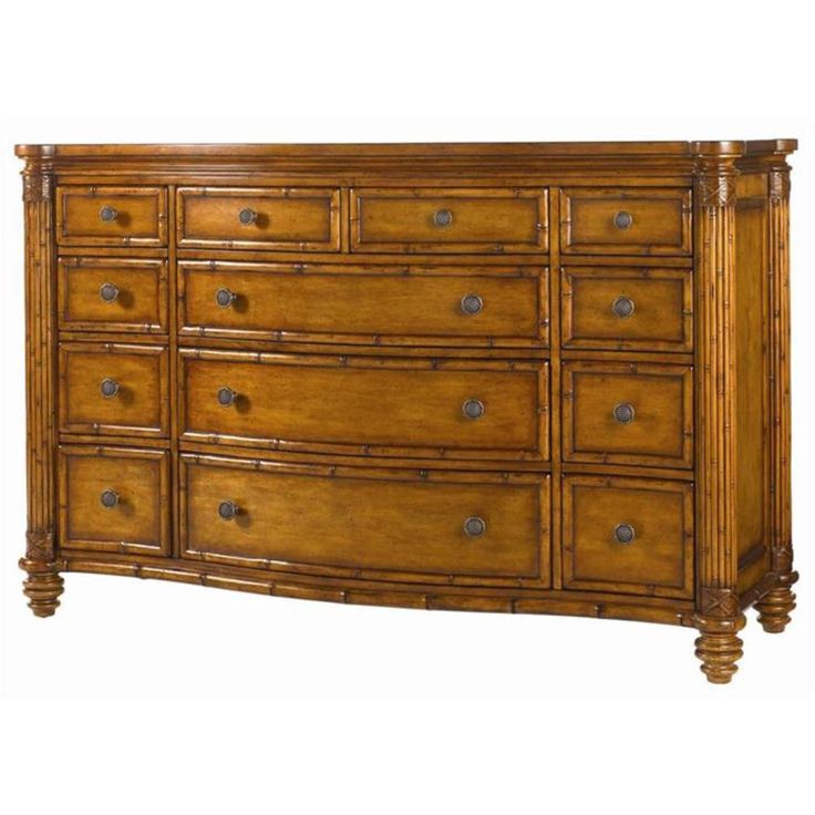 a wooden dresser with many drawers and knobs