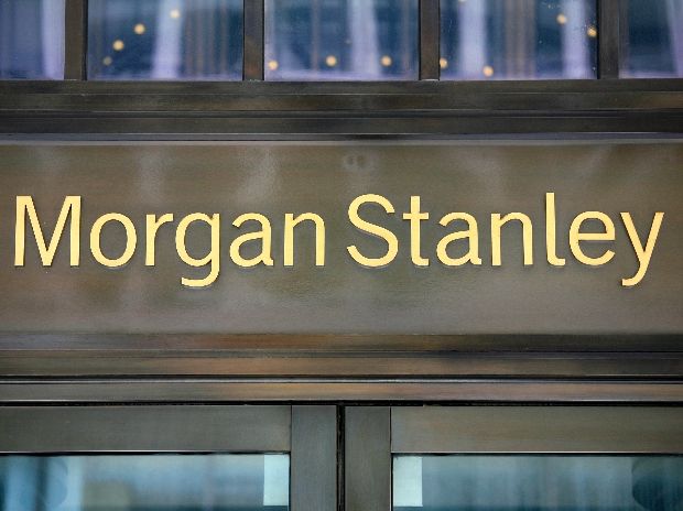 the morgan stanley building sign is lit up in front of it's glass doors