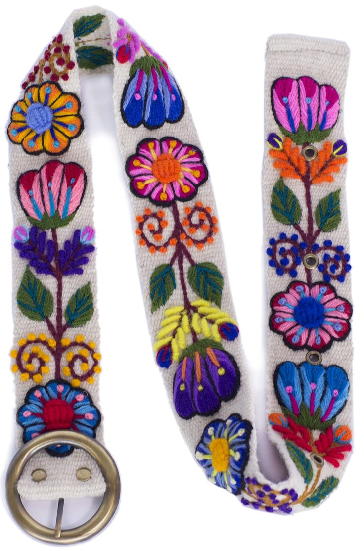 a white belt with colorful flowers on it and a metal ring hanging from the side