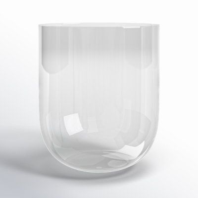 a white vase sitting on top of a table