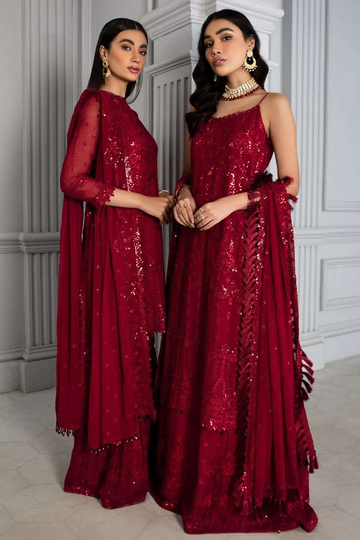 Embellished Red Pakistani Dress with Gharara is a breathtaking and stunning Pakistani Fancy Dress with luxurious decorations on it. This dress with lavish floral patterns makes this Pakistani Dress a must-buy product if you are looking for Pakistani Wedding Party Dresses. Kameez: This Red Pakistani Dress comes with a beautiful kameez in premium quality chiffon. This kameez is beautifully decorated with fine embroidery work accompanied by iridescent sequins. Furthermore, beautiful artistry on the Red Pakistani Dress, Embroidered Sharara, Raw Silk Fabric, Chiffon Sleeves, Pakistani Designer Suits, Pakistani Fancy Dresses, Chiffon Collection, Embroidered Chiffon, Pakistani Dress