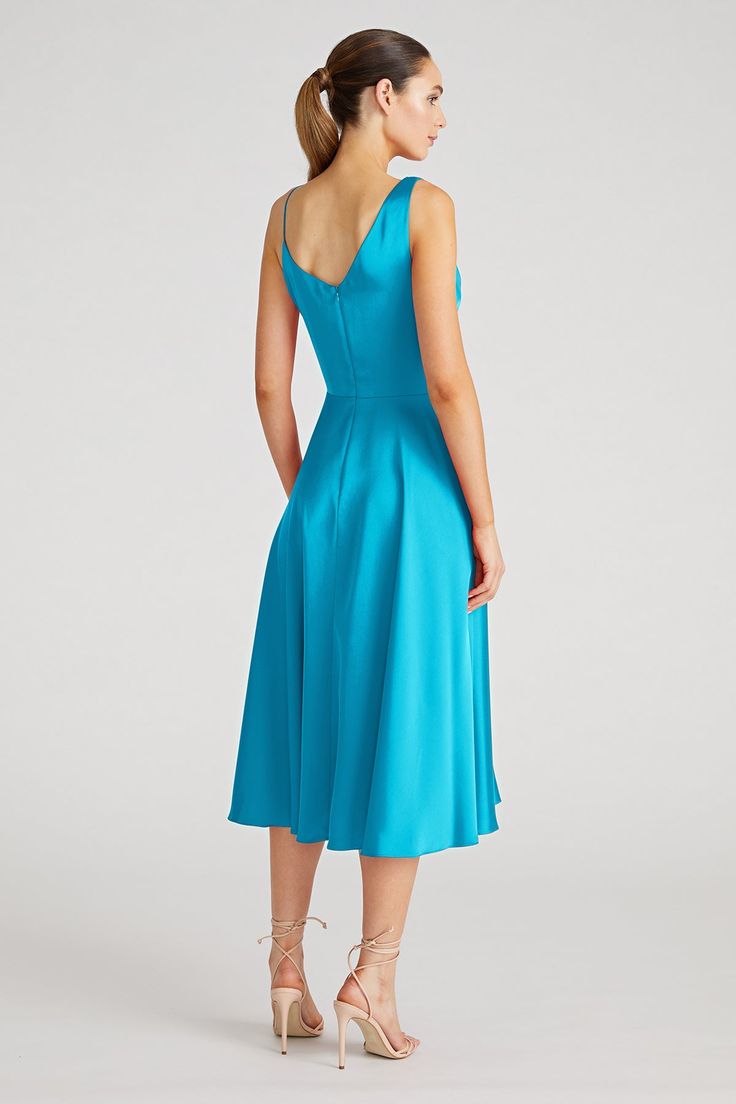 Experience the charm of the Hayden Dress, a luxurious satin A-line midi. Its asymmetrical cowl drape bodice and undulating pleats form a graceful, hypnotic silhouette, ideal for any elegant event. Cowl Neck A Line Silhouette Sleeveless Below Knee Length REF: 88111782 A Line Midi Dress, High Hips, Color Stories, Pastel Blue, Signature Style, Cowl Neck, Evening Gowns, Bodice, Knee Length