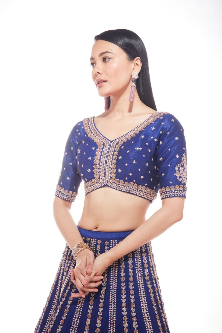 Blue silk lehenga with intricate motifs at the base and delicate lines of zardozi paired with matching blouse and net dupatta with thick main border and thinner borders on 3 sidesFrom Chamee and Palak 's The Wedding Edit collectionDELIVERY TIMEPlease allow 8-12 weeks for your outfit to arrive.FABRIC DETAILSSilk And NetProfessional cleaning only. Blue Pre-draped Saree With Pallu For Wedding, Elegant Silk Thread Choli For Eid, Blue Anarkali Lehenga With Intricate Embroidery, Silk Thread Sets With Zari Work For Reception, Fitted Silk Thread Sharara With Intricate Embroidery, Semi-stitched Royal Blue Blouse Piece For Wedding, Fitted Royal Blue Choli For Saree, Fitted Royal Blue Choli, Dola Silk Choli With Unstitched Blouse For Reception