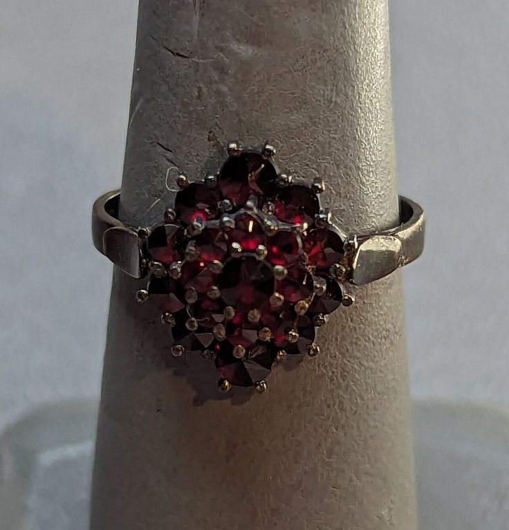 Antique Bohemian Garnet 900 Silver ring. Ring features three layers of rose cut Garnets prong set. Ring is fully hallmarked and will arrive gift boxed. HALLMARKS 900. SIZE 6, ring could be resized by any jeweler. Ring measures 14mm running north to south on finger. WEIGHT 2.56 Grams. CONDITION In very good to excellent condition, please use all pictures as part of description. MATERIALS 900 Silver, Garnets. Ruby Engagement Ring, Fancy Jewellery, Red Band, Set Ring, Unisex Ring, Art Deco Era, Ring Ring, Rings Statement, Rose Cut