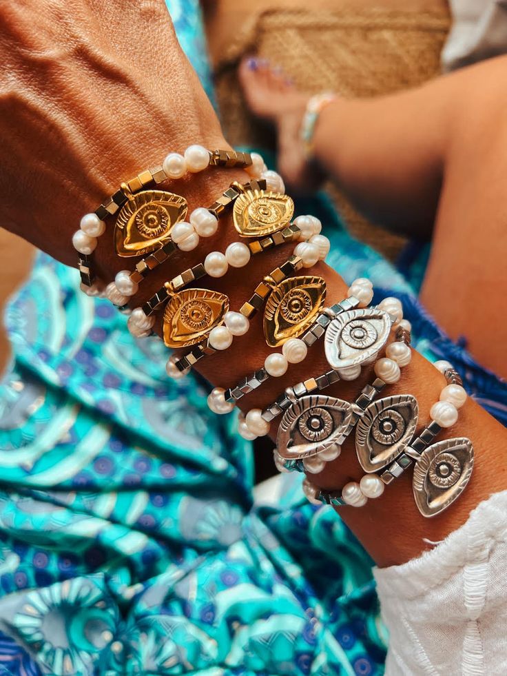 Shop the vacation-ready looks in our picks below, and you'll be set for summer. Catch the wave of these fun summer jewelry trends: Get them now before they're gone. Our beaded bracelets are a must in every summer wardrobe! Hand made of semiprecious gold and silver tone hematite beads, combined with impressive gold/silverplated evil eyes  Silicon band is used , so they are adjustable to all hands  Choose your favorite color! Combine these beauties with more from our wide collection! PLEASE LEAVE Summer Metal Bracelets As A Gift, Summer Metal Bracelets As Gifts, Summer Metal Bracelets For Gifts, Summer Metal Beaded Bracelets, Summer Beaded Metal Bracelets, Summer Metal Bracelet For Gift, Summer Gift Metal Bracelets, Spiritual Stretch Bracelet For Beach, Adjustable Metal Bracelets For Vacation