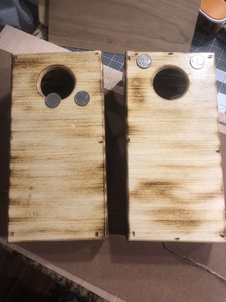 two pieces of wood with holes in them