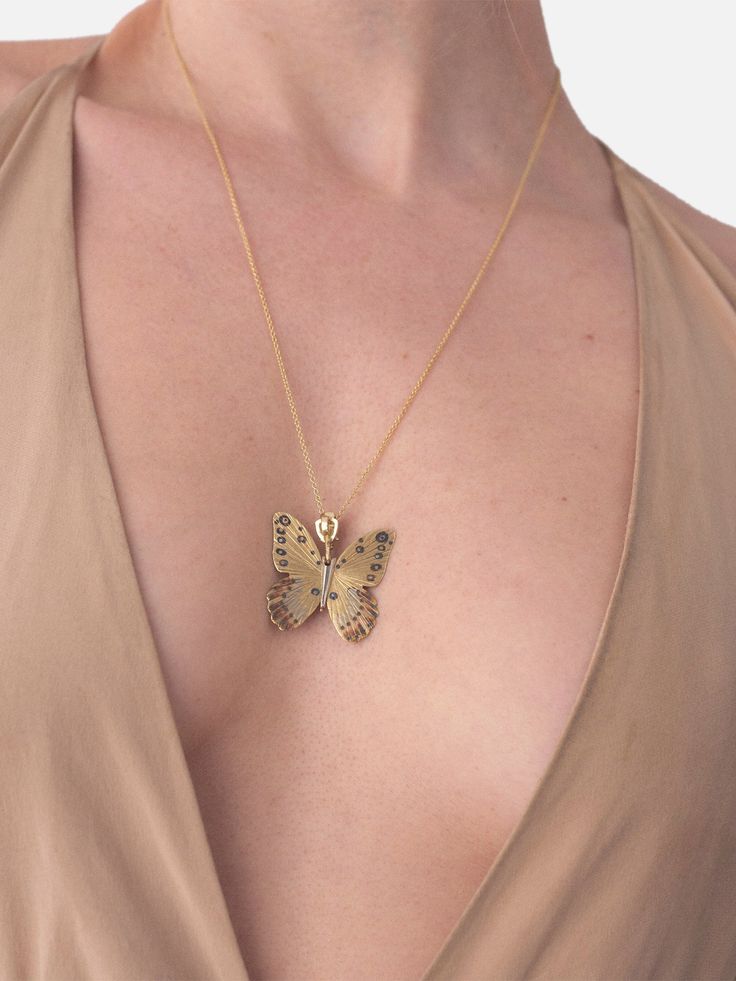 The Goliath Birdwing Necklace is hinged at the center to allow for movement of wings. This piece is made from 14k rose gold with yellow gold and white gold inlay and a white diamond pave crown. Each butterfly is inspired by the various species of butterflies around the world, using an ancient inlay process to create the illusion that the details on the butterflies are painted to represent their unique patterns in the wild. 14k Rose Gold with 18k Yellow Gold & 18k White Gold Inlay 23” 14k Rose Go Luxury Sterling Silver Butterfly Necklace, Yellow Gold Butterfly Diamond Jewelry, Butterfly Shaped Yellow Gold Diamond Jewelry, Luxury Diamond Jewelry With Butterfly Charm, Butterfly-shaped Yellow Gold Jewelry With Diamond Accents, Luxury Butterfly White Gold Jewelry, Luxury Butterfly Shape White Gold Jewelry, Luxury White Gold Butterfly Jewelry, Luxury Butterfly Shaped White Gold Jewelry