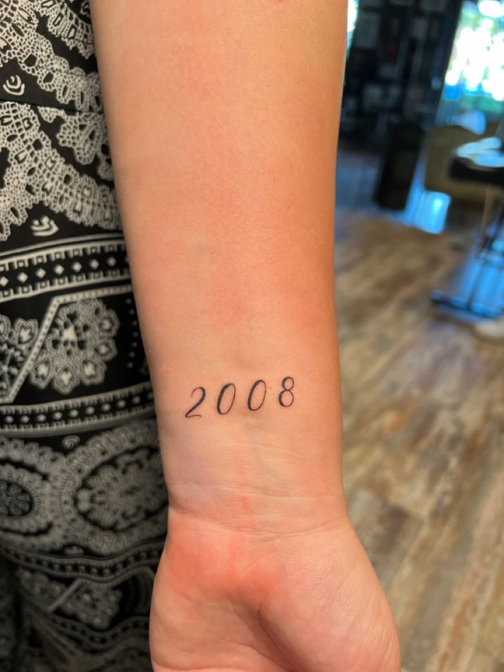 Year 2008 tattoo idea fine line minimal 2008 Tattoo Ideas, 2010 Tattoo, Tattoo For Female, 2008 Aesthetic, Tattoo Goat, Tattoo On Thigh, Patchwork Tattoos, Tattoos 2023, Number Tattoos