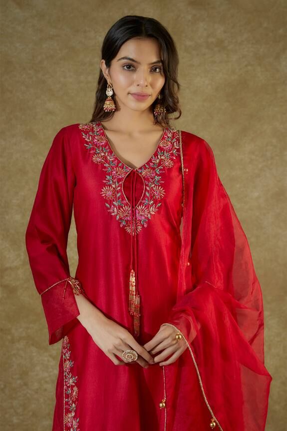 Red straight kurta, highlighted with floral hand embroidery using zardozi and glass beads. Paired with a palazzo and dupatta with gold latkans. - Aza Fashions Red Kurta With Intricate Embroidery For Traditional Ceremonies, Red Elegant Kurta For Traditional Ceremonies, Elegant Red Kurta For Traditional Ceremonies, Designer Red Kurta With Intricate Embroidery, Red Embroidered Slub Silk Anarkali Set, Red Embroidered Slub Silk Kurta, Red Embroidered Palazzo Set With Straight Kurta, Festive Embroidered Red Palazzo Set, Red Raw Silk Kurta With Intricate Embroidery