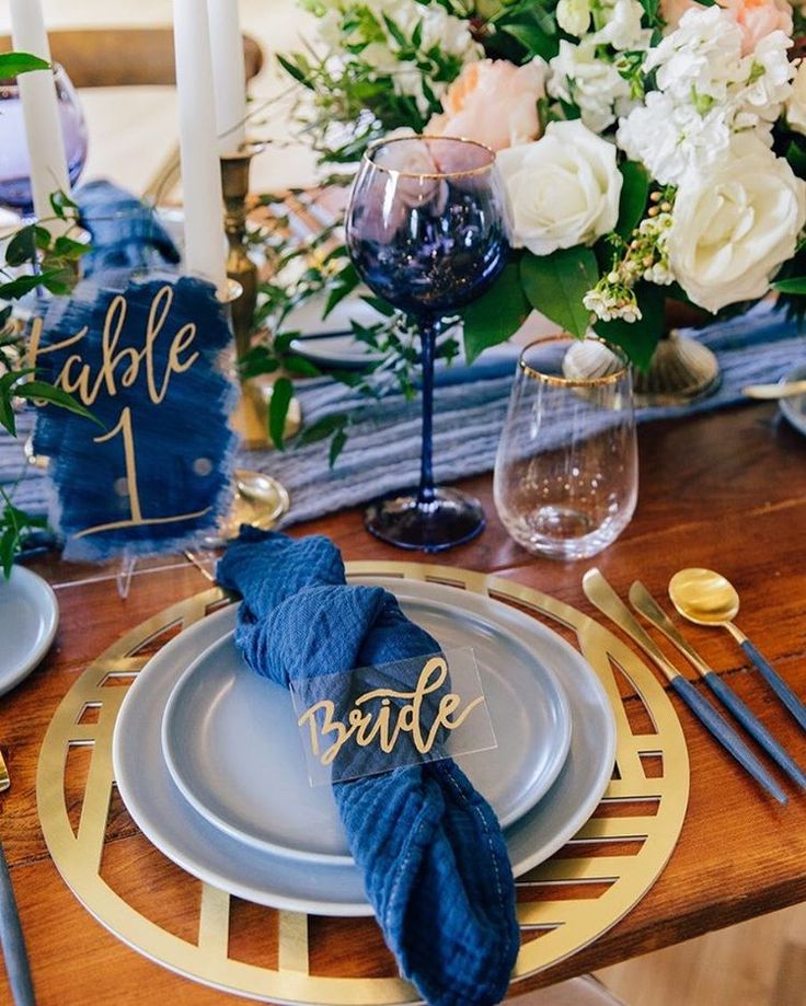 a table set with plates and place settings