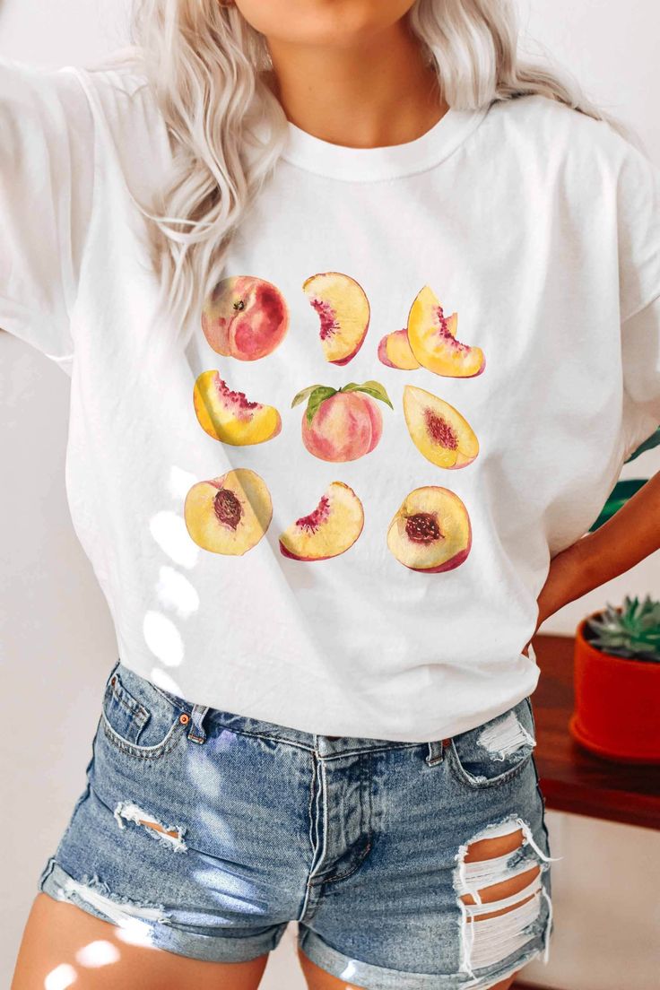 This item is individually MADE TO ORDER just for you! If you want an oversize fit, please size up from your original size. Model is wearing Natural in size Large. * I T E M * I N F O* ✦ Unisex, soft cotton shirt and quality long lasting print ✦ Shirts are true-to-size for UNISEX fit. If you want an oversize look size up from your original size. ✦ Please see size guide in the listing photo for all measurements and information. ✦ We DO NOT accept returns, exchanges, or refunds for incorrect fit, so please choose your size wisely! ✦ Colors may differ slightly due to different user monitor and screen settings. * C A R E * ✦ Items should be washed on DELICATE cycle and inside out to maintain the quality of your design. ✦ Tumble dry on LOW. Do not iron. ✦ We are NOT responsible for damage to pro Casual Peach T-shirt With Graphic Print, Peach Graphic Print Short Sleeve Top, Peach Short Sleeve Top With Graphic Print, Peach Crew Neck Top With Graphic Print, Summer Peach T-shirt With Graphic Print, Peach Casual T-shirt With Graphic Print, Peach Short Sleeve Shirt For Summer, Casual Peach Summer Shirt, Summer Peach Cotton Shirt