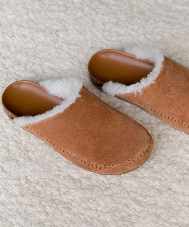 Shearling-Lined Moc Clog Saddle Our take on the classic shearling clogs. As luxuriously cozy as slippers, but made to be worn anywhere. We know that comfort is key—with a cork sole that molds to your feet, you'll never want to take these off. Suede with shearling lining. Handmade in Italy. | Jenni Kayne Shearling-Lined Moc Clog Size 41 Red Converse Shoes, Plaid Shoes, Black Leather Mules, Cheap Toms Shoes, Mia Shoes, Suede Clogs, Jenni Kayne, Suede Mules, Funky Shoes