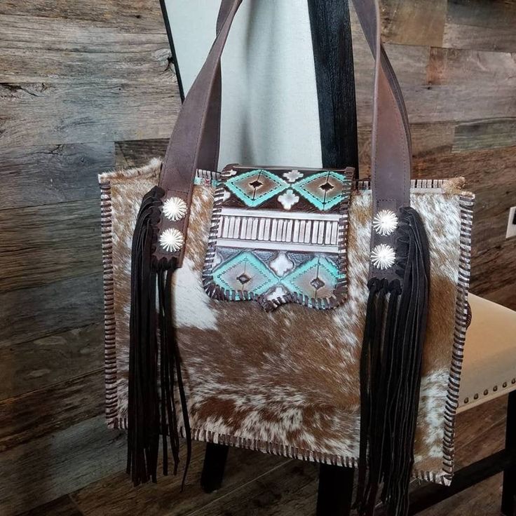 All Handmade items take approx 6 to 8 weeks to make, please message us prior to purchase it you need it sooner. This is a gorgeous cowhide X-LARGE COWHIDE DIAPER BAG WITH DOUBLE LEATHER HANDLES The bag is made from a BRAZILIAN Cowhide and is lined with faux suede. The outside measurements of the bag are 17 x 13 x 6 1/2 . The inside has pockets on both sides. There is a magnetic snap that holds the flap to the front of the bag. The bag is topped off with, 1 outside bottle pocket & tons of fri Artisan Hand-tooled Shoulder Bag, Artisan Hand Tooled Bag For Travel, Artisan Hand-tooled Pouch Bag, Artisan Hand Tooled Travel Bag, Artisan Hand Tooled Pouch Bag, Luxury Hand-tooled Satchel For Travel, Luxury Hand Tooled Satchel For Travel, Artisan Satchel Bag With Leather Backing, Luxury Hand-tooled Travel Satchel